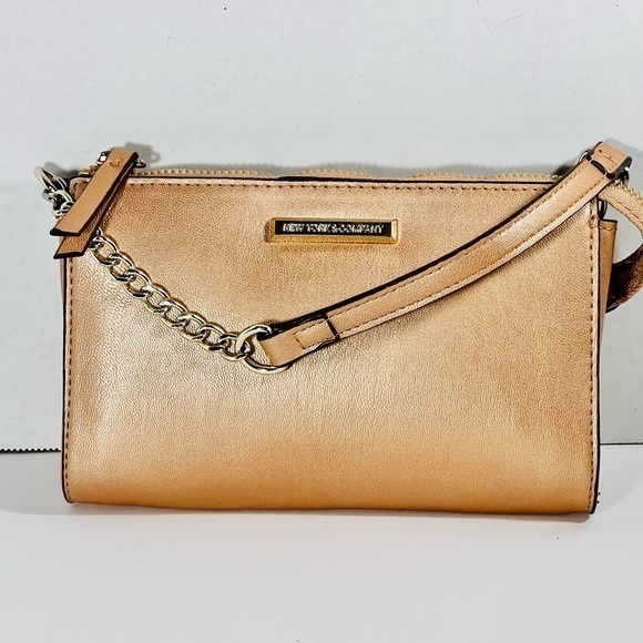 New York & Company Handbags - Jones New York Beautiful rose gold hand bag/ clutch